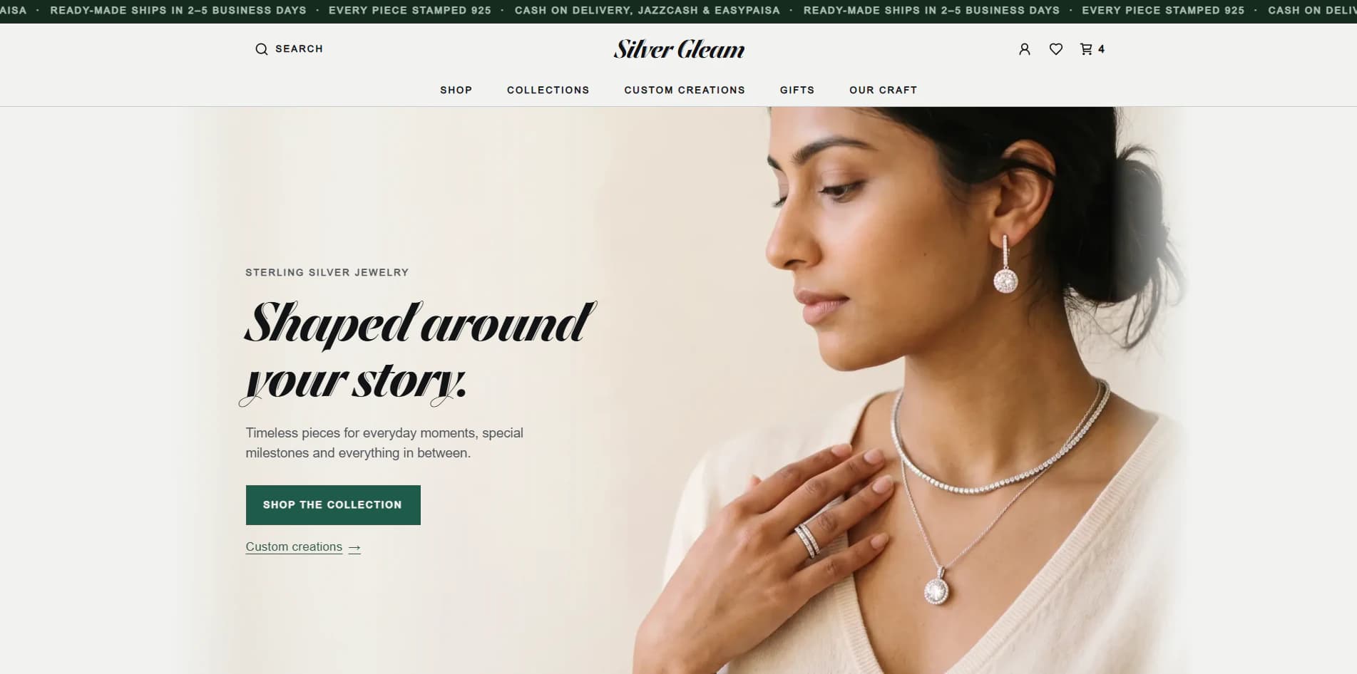 The Silver Gleam demo's home page, with its headline “Shaped around your story.” beside a photo of a woman wearing silver earrings, necklaces and a ring.